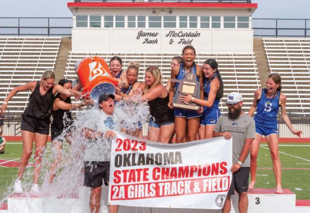 The Stroud Lady Tigers track team douses coach Kelly Brown with iced water after winning the state championship in May. The photo taken by Mario Holland was chosen the best photo taken in May and published in Oklahoma’s 160-plus newspapers