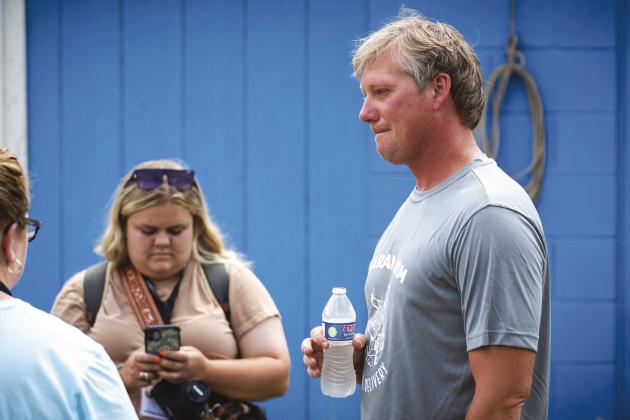 Travis Marak speaks to members of the American Milking Shorthorn Society during an event at his Meeker dairy in June.