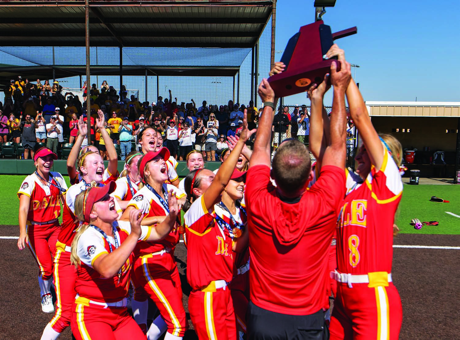 Dale’s Lady Pirates celebrate their fast-pitch state championship Saturday at Firelake. The DLPs beat Warner, 4-2, in nine innings to claim their eighth fastpitch title. For more on area sports, see Section C. Photo/Rick Hester