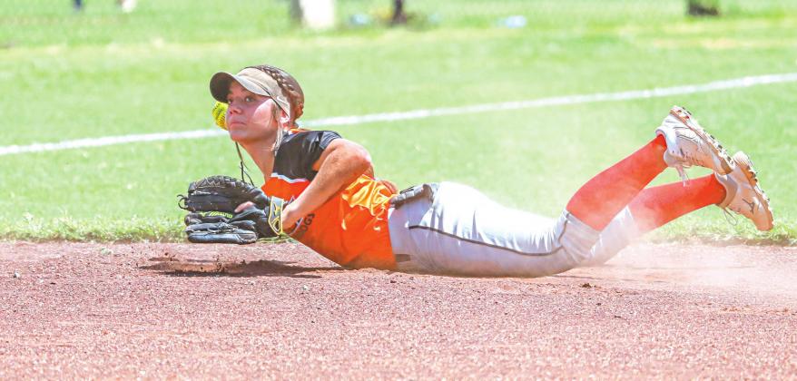 A few of our favorite sports photos from 2020: top, the Chandler Lions beat Stroud in football for the first time since 2008 and enjoyed the trophy; right, Riley Randall from Meeker was all alone as he ran to the state championship in cross-country; bottom, Carney shortstop Emma Hubach lays out for a groundball; below, Carson Funk from Davenport breaks into the clear against Victory Christian; and left, are Dylan Collins from Stroud and Peyton Ezell from Prague.