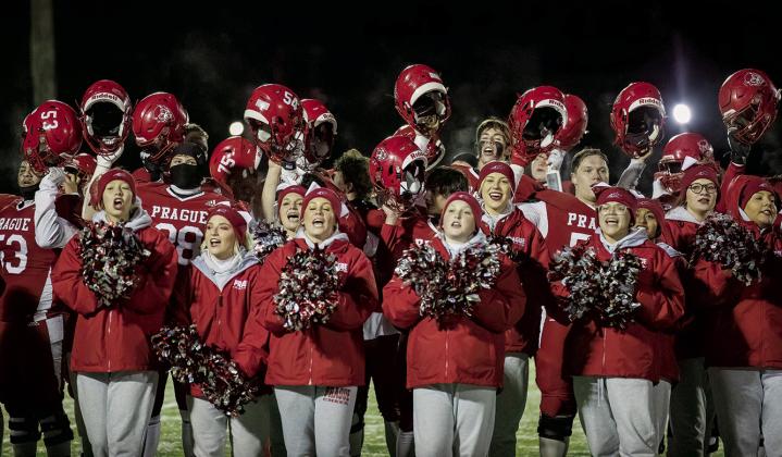 The Red Devils hammered Hugo, 34-14, Friday night to advance to the second round of the Class 2A playoffs Friday night. They’ll head to Victory Christian this week. At left, Trevor McGinnis finishes a physical run. Above, players and cheerleaders celebrate after the victory. Photos/Rick Hester