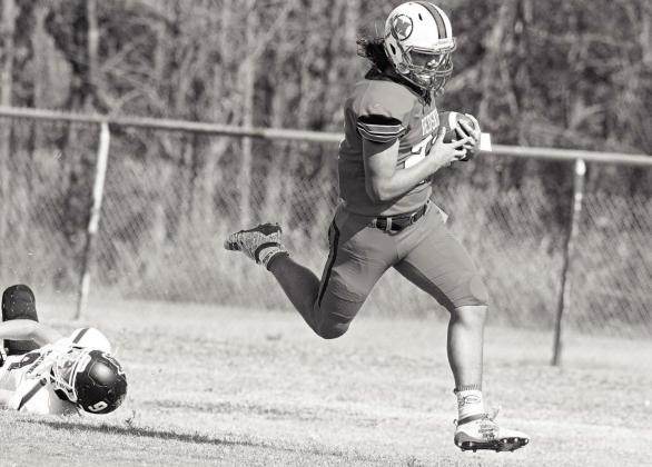 Clint Campbell leaves a would-be tackler in his wake as he sprints to a touchdown against Bridge Creek Saturday afternoon.