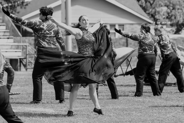 Allison Radcliffe throws her arms out during Chandler High School’s prelim performance at the Blue and Gold Marching Band Classic. Photo/Jennifer Pryor