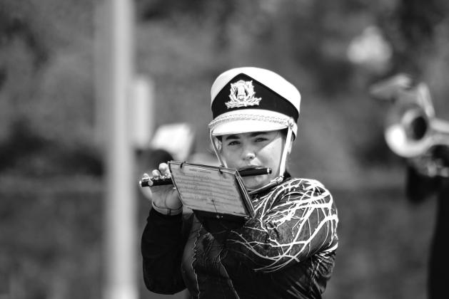 Charlee Moore from the Meeker marching band performs on piccolo during the prelims on Sept. 26. Photo/Landon Gray