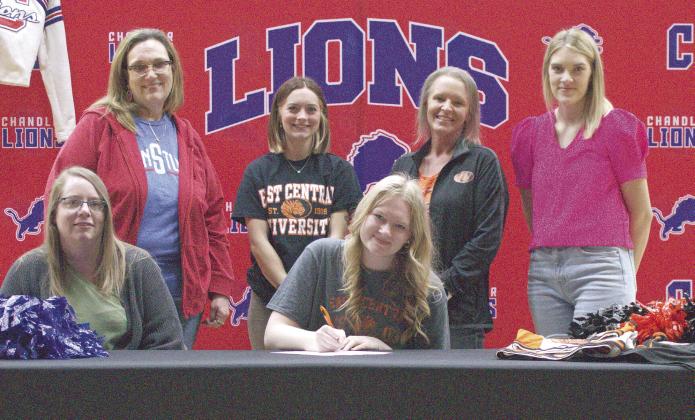 Chandler cheerleader Gabby Dawson signed a letter of intent last week to cheer for East Central University. Pictured from left are her mother, Amanda Williams, Chandler High School Cheer Coach Cynthia Snider, ECU Cheer Coach Syndie Hall, Gabby Dawson, ECU Head Cheer Coach Janesa Miller and ECU Cheer Coach Lauren Williamson. Photo/Jennifer Pryor