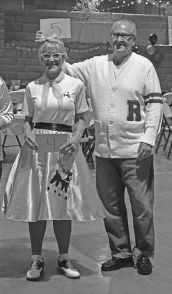 Susan and Mark Pordos pose during the costume contest at the Route 66 100th Birthday Party Sock Hop held at the Route 66 Interpretive Center in Chandler on Oct. 16. The event was hosted by the Chandler Area Chamber of Commerce. Photo/Emily Kalka