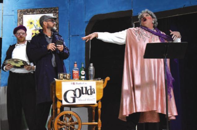 Howard Houston attempts to save the play by appearing as Lady Barrington, much to Chris Reed (center) and Tyler Peters’ (left) surprise. Photo/Emily Kalka