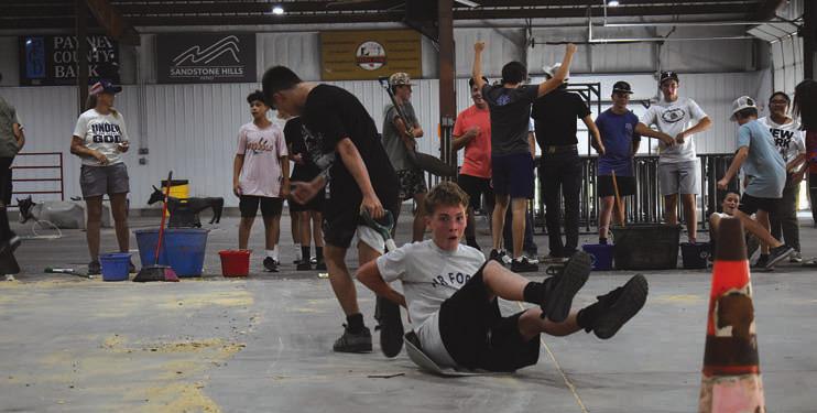 Bentley Powers pulls Nathan Drury during the Farmhand Olympics. Photo/Emily Kalka