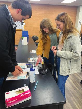Chandler students Ethan Stone, Emma Cummings and Sadie Sherman work as a team to analyze water samples during the Environmental and Natural Resource competition at the SSC FFA Interscholastic Contest on April 14. Chandler placed 3rd out of 13 teams.