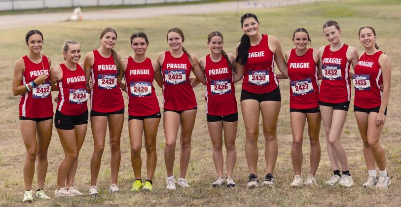 Prague’s conference champion girls cross country team, from left,, Jaeden Evig, Jocelyn Ward, Hailey Johnson, Hanna Rolette, Jaxi Friend, Lakeyn Kinslow, Lucy Shelburne, Kinley Novotny, Avery Thomas and Sadie Thomas. Photo/Beth Young