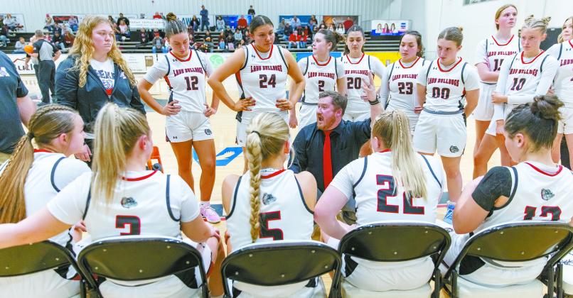 Meeker coach Doug Jones talks to his team during a timeout in their overtime loss to Pawnee for the district championship. Photo/Rick Hester