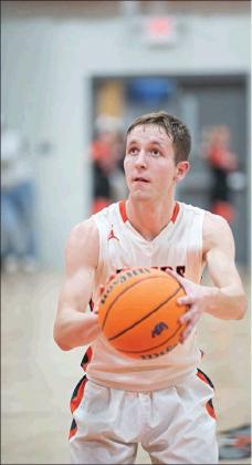 Right, McKoy Coulson, right, eyes the bucket before dropping in a free throw in the fourth quarter. He finished with 19 points. Photos/Brian Blansett