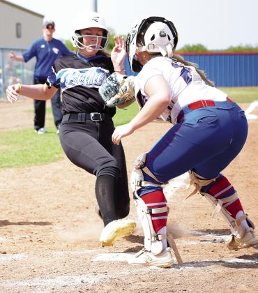 Chandler catcher Rylee Capps tags out a Bethel runner during the Lady Lions’ 12-3 win in district play Thursday. Chandler went on to beat Ada, 16-8 and 14-10, to win the championship. Photo/Brian Blansett
