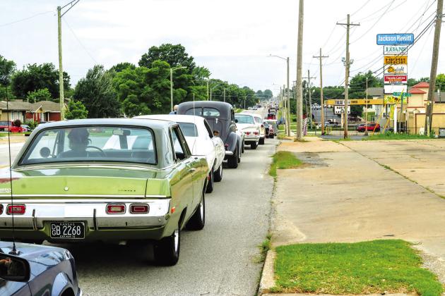 A long line of cars stretches out nearly two miles in Tulsa on Saturday morning, full of classic car enthusiasts hoping to take part in the world-record-breaking Route 66 Captial Cruise. Photo/Jennifer Pryor