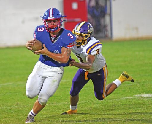 Jarin Greenfield (3 in blue) returns an interception during the second half Friday night while Bristow’s Charles Ware (3 in white) pursues. Photo/Brian Blansett