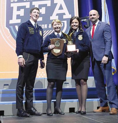 Shaley Barnes (second from left) of the Wellston Chapter accepts his award at the 96th State FFA Convention and Expo May 4 at the BOK Center. This award was presented by Kade McGowen (far left), Oklahoma FFA central area vice president, Abby Bell, Oklahoma FFA reporter and Zac Swartz, Oklahoma Farm Bureau representative.