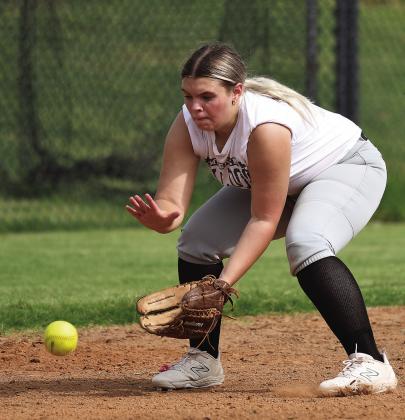 The chandler Lady Lions and Meeker Lady Bulldogs joined area softball teams who kicked off fast-pitch practice recently. Left, Chandler senior Carson Jackson throws to first base during drills and, right, Meeker sophomore Rylee Standlee eyes a grounder into her glove. Fastpitch season begins Aug. 7. In their openers, Chandler will host Beggs on Aug. 8 and Meeker will travel to Wellston the same day. Photos/Brian Blansett