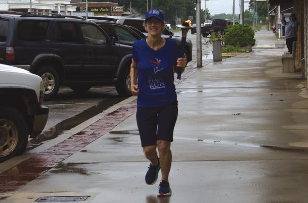 A member of the Sri Chinmoy Oneness-Home Peace Run makes her way through Chandler on May 21. The four-month run will go through all 50 states and covered 71 miles from Bristow to Oklahoma City on Route 66. The run is to celebrate the 250th anniversary of the United States. Photo/Emily Kalka