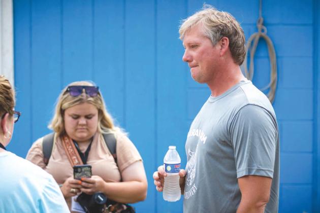 Travis Marak speaks to members of the American Milking Shorthorn Society during an event at his Meeker dairy in June.