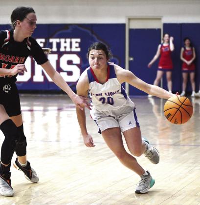 Chandler’s Carson Jackson drives against Morris during district action Saturday night. Photo/Brian Blansett.