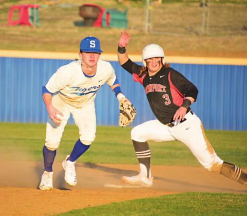 Pictured to the lower left, with his opponent safe on second base, Bryce Hughey looks towards the mound to throw the ball. Photos/Chelsea Weeks