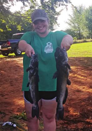 Above, Lincoln County News reporter Chelsea Weeks holds two channel cats she noodled.