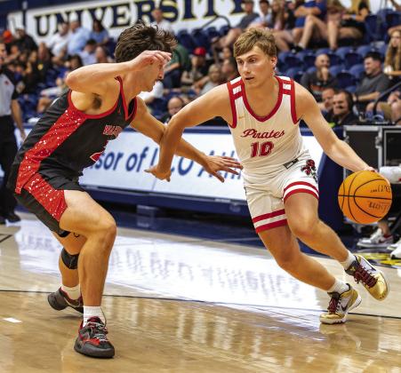 Levi Kelly drives toward the baseline. Photo/Rick Hester