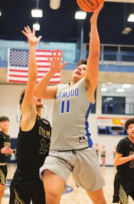 Pictured above, despite his opponent’s attempt to block him, Chasen Neuman shot the ball and scored a point for the Tigers. Pictured to the left, Skyla Baker maneuvered through her opponents to take the ball to the basket and score a point for the Lady Tigers. Pictured below, Zeb Blancarte didn’t let his opponent stop him from driving the ball in and making the basket. These pictures were taken at the game against the Okemah Panthers Tuesday, Feb. 11. Photos/Chelsea Weeks
