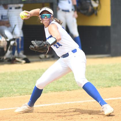 Above, Stroud freshman third baseman Miyah Clark throws to first during actiom against Chandler Saturday at the 66 conference tournament at Okemah. Right, Proud father and grandfather Daniel Allen (left) and Larry Snovel broke out the family spirit to cheer on Bella Allen, who pitched for the Lady Lions Thursday in the first round of the tournament at Chandler. Photos/ Brian Blansett
