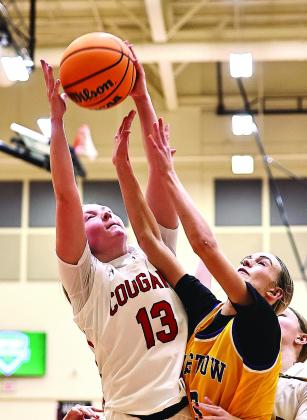 North Rock Creek’s Olivia McRay goes up in a crowd for a rebound during the Lady Cougars’ loss to Bristow Saturday night during district play. The Lady Cougars are back in action Thursday, facing Nathan Hale at 1 p.m. in Bristow. Photo/Sheryl Gowin