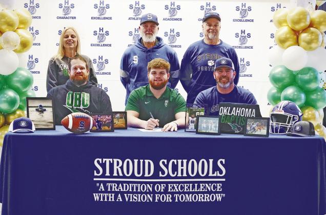 Stroud lineman Peyton Gaylord signed his national letter of intent to play football at Oklahoma Baptist University. Gaylord helped lead the Tigers to an undefeated district season, a 10-3 record and a berth in the state quarterfinals. He is pictured with his father, Clint Gaylord, to his left; head coach Josh Presley, to his right; his mother, Heather Gaylord; Stroud Asst. Coach Tim Hinds and Stroud defensive coordinator Neal Bacon.