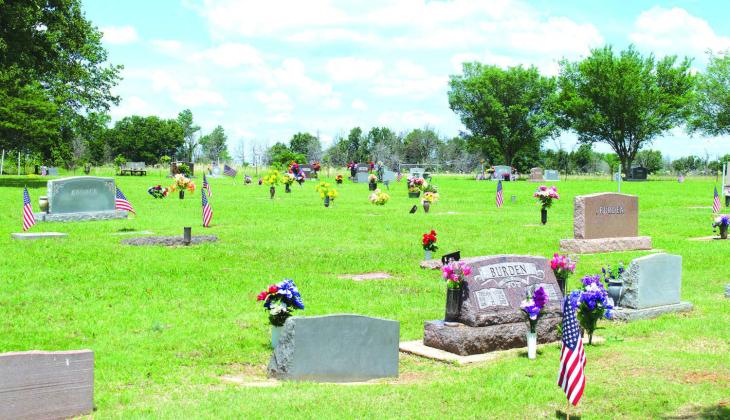 Above is a view of New Zion Cemetery located between Chandler and Davenport on Memorial Day. The cemetery is filled with flowers and flags commemorating the holiday. Photo/Emily Kalka