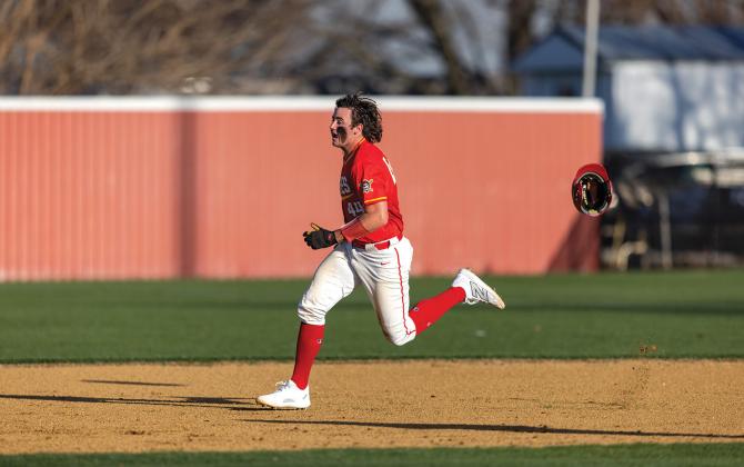 Jack Rooker runs so fast his helmet can’t keep up on his way to second base for the double during the opener against Chisholm. Photo/Rick Hester