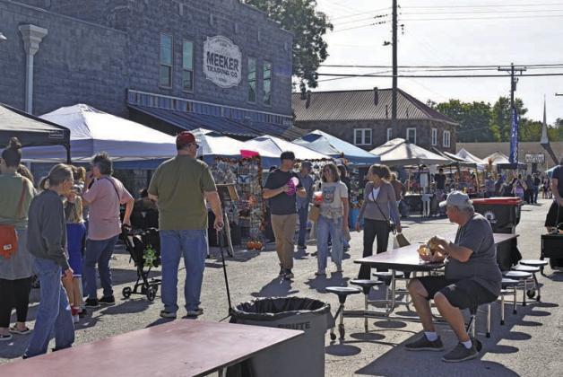 Visitors enjoy the many food trucks and booths at the Meeker Pumpkin Festival on Saturday, Oct. 24. Photo/Emily Kalka