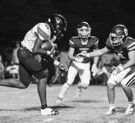 Top right, Blake Rickner (8) picks up a block from Kaled Foster (55) en route to a gain for Chandler against Kellyville. Photo/Brian Blansett Chandler quarterback Alec Jackson cuts upfield on a keeper. Blocking are Stran Messer (51) and Easton Manning (53). Photo/Brian Blansett Below, Davenport’s Dez Finney (45) gets ready for contact against Southwest Covenant. Photo/Mario Holland Bottom, Meeker’s Jason Brewer sticks Bethel’s quarterback during the Bulldogs’ district win. Photo/ Rick Hester