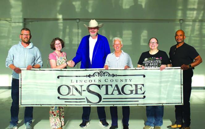 Members of the LCOS Board stand with Michael Bay (center), who donated the Collar Building for the theatre. From left to right, Shane Miller, Mandy Myers, Bay, Sheri Jones, Katie Smith and Jessie Glover-McPherson. Photo/Emily Kalka