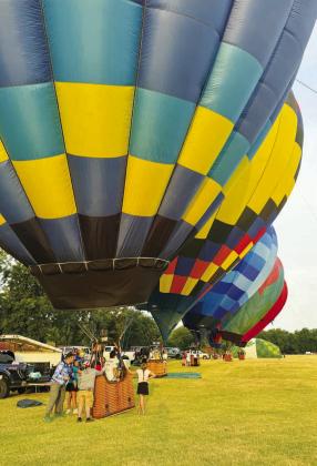 Crews inflate their hot air balloons Friday morning at the Ninth Annual Citizen Potawatomi Nation Balloon Fest. The three-day event featured two dozen hot air balloons, balloon rides and entertainment. Photo/Brian Blansett