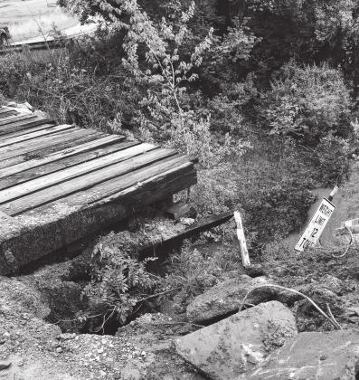 A bridge that absorbed flood damage on East 1060 Road in Lincoln County. Photo/Brian Blansett