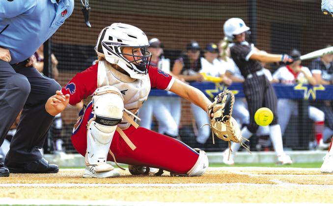Chandler’s Ruthie Capps catches a pitch from teammate Allen.