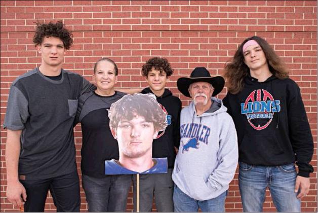 At right, he is pictured with his grandmother, Laura Williams, Braxden (center), grandfather Rick Williams and Darian. Photo/Brian Blansett