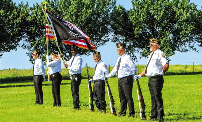 The American Legion Post #64 color guard stands at ease at Davenport Cemetery on Monday morning. Photo/Jennifer Pryor