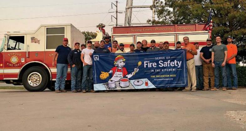 Pictured above, Kent Clovis stands with the Stroud Fire Department. Photo/submitted.