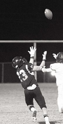 Above left, the scoreboard tells the tale as Caleb Chapman intercepts a CCS pass in the waning seconds. Above right, Zach Cook brings in a Caden Wolford pass for a 95-yard touchdown in the third quarter Friday night. Photos/Brian Blansett
