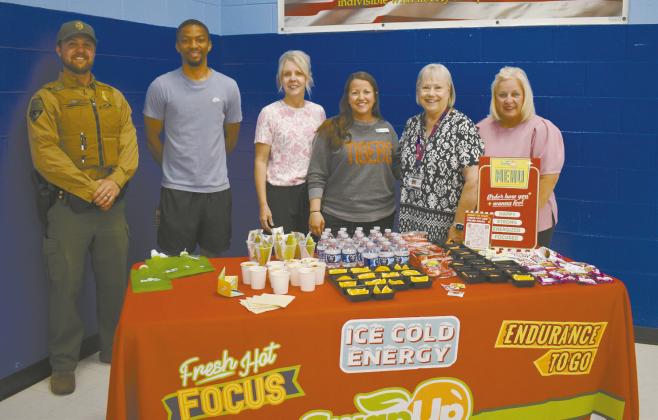 From left to right are Lincoln County Game Warden Jacob Harriet, Coach Damon Parker, Family Support Coordinator Gina McVey, School Nurse Jessica Todd, Sherri Ripley with TSET and Diann Merrmann with the Lincoln County Partnership for Child Well-Being. Photo/Emily Kalka