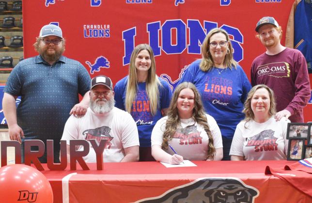 Makyela Dawkins from Chandler, front row, center, signed with Drury College from Springfield, Mo., for the STUNT team. She is pictured with (back row) Jason Brown, Hannah Smith, Cynthia Snider, Keegan Dawkins (front row) Jerry Dawkins and Taressa Dawkins.
