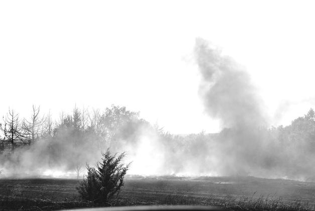 Smoke rises from a field after fire departments extinguished a grass fire near Kendrick on Aug. 20. Photo/Emily Kalka