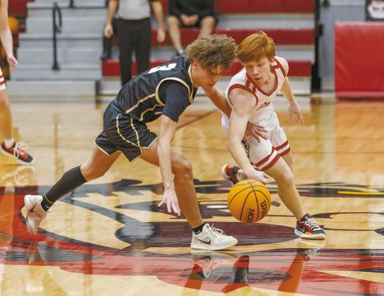 Above, Dale’s Easton Edmonson (1) deflects a ball in the Pirates’ game against Mounds. Photo/Rick Hester