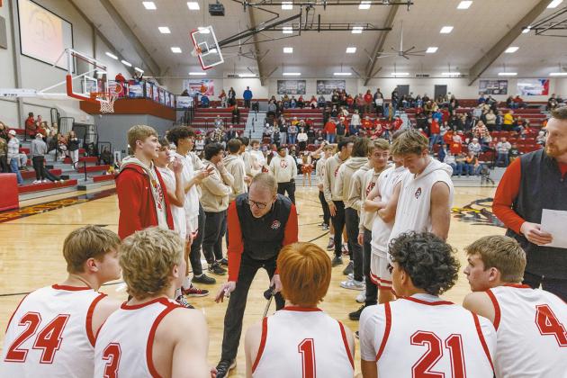 Below, Dale coach Jeff Edmonson has a few words for the Pirates before pre-game introductions. Photo/Rick Hester