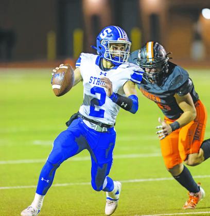 Stroud quarterback Dylan Baker looks for a receiver as he rolls out Friday night. Photo/Rick Hester