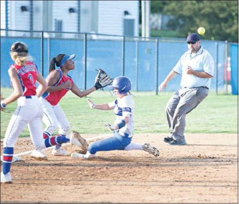 Stroud senior Terra Mitchell slides safely into third base in their 3-2 win over Chandler last week. Waiting for the throw is the Lady Lions’ Jaelynn Robertson. Photo/Tommie Marshall